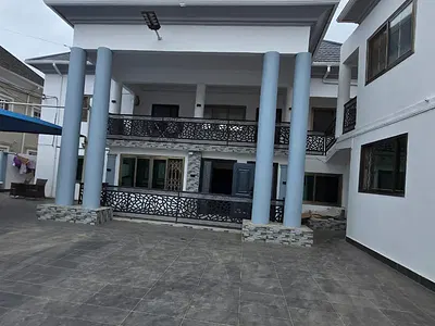 9 Bedroom Storey House with Outhouse — Dansoman, Accra